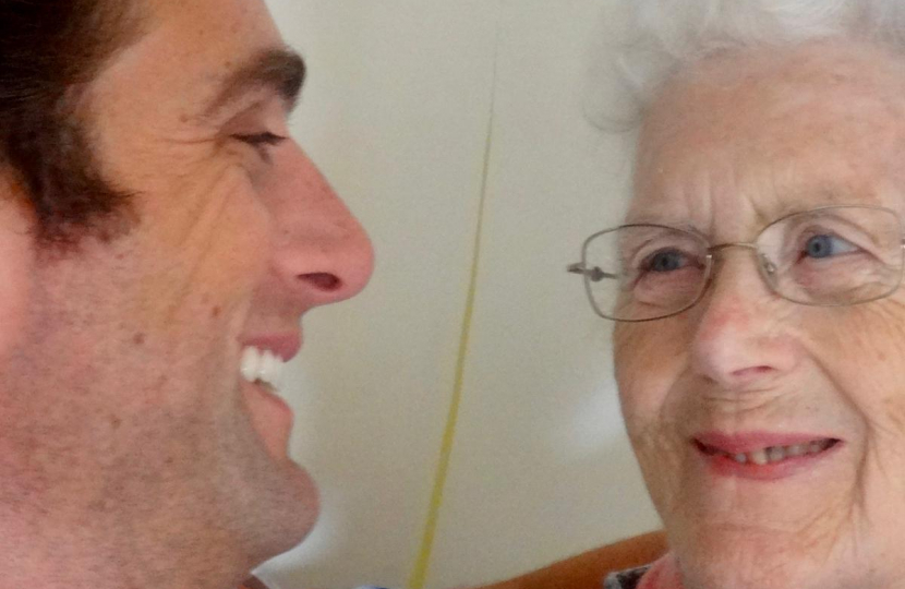Alex Clarkson and his late nan looking at each other and smiling.