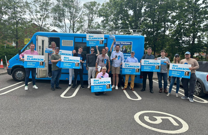 Alex Clarkson with supporters and his battle bus