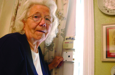 An OAP standing by her door.